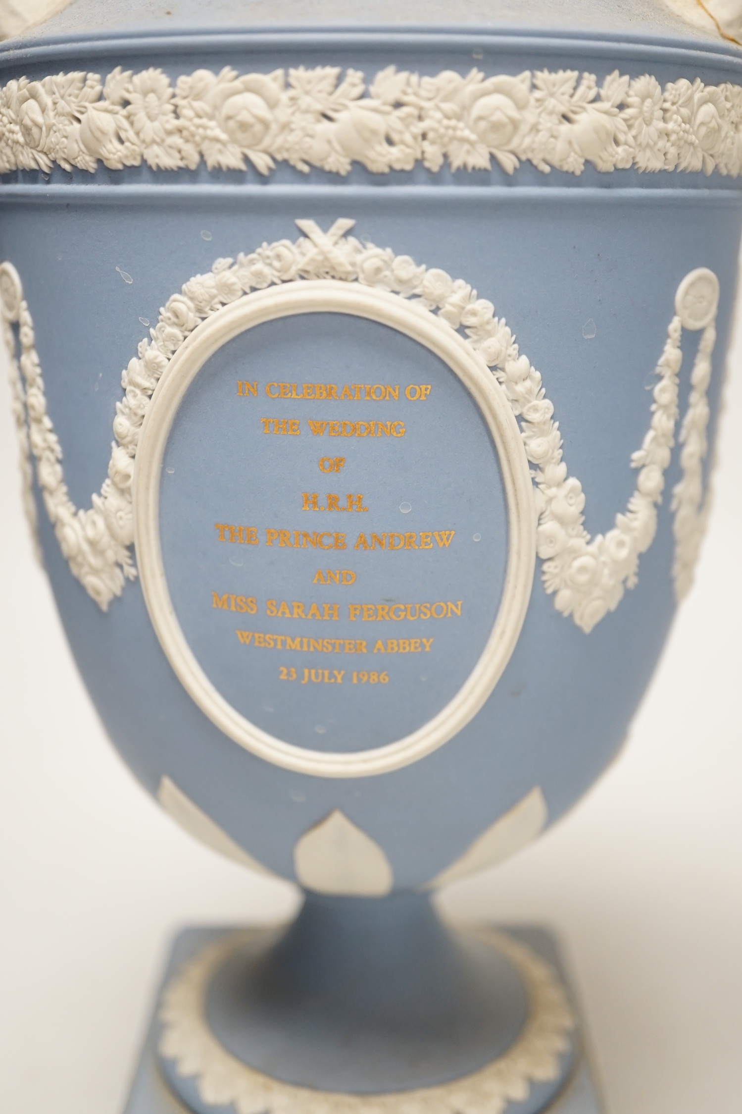 A Wedgwood blue jasper commemorative urn and cover and a similar smaller urn and cover, tallest 31cm
